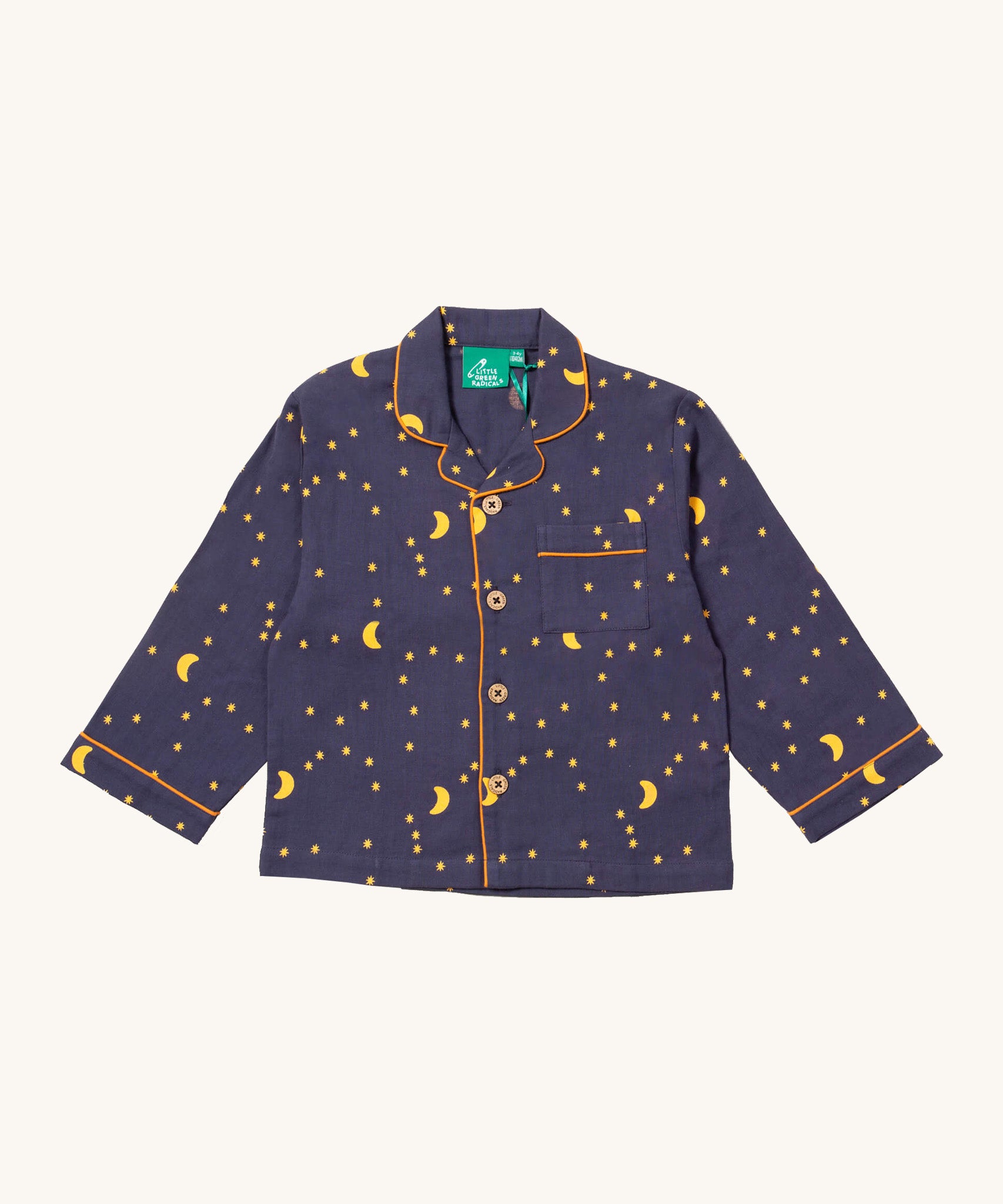 Little Green Radicals classic pyjama top from the dark night classic set. A GOTS organic cotton pyjama top in a classic shirt type style in navy with yellow trim and a starry night design. Features button fasteners and a small chest pocket.