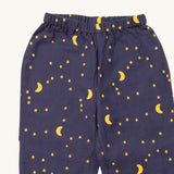 A close up of the Little Green Radicals classic pyjama bottoms from the dark night classic set. Showing the starry night print detail on navy organic cotton fabric.