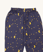A close up of the Little Green Radicals classic pyjama bottoms from the dark night classic set. Showing the starry night print detail on navy organic cotton fabric.