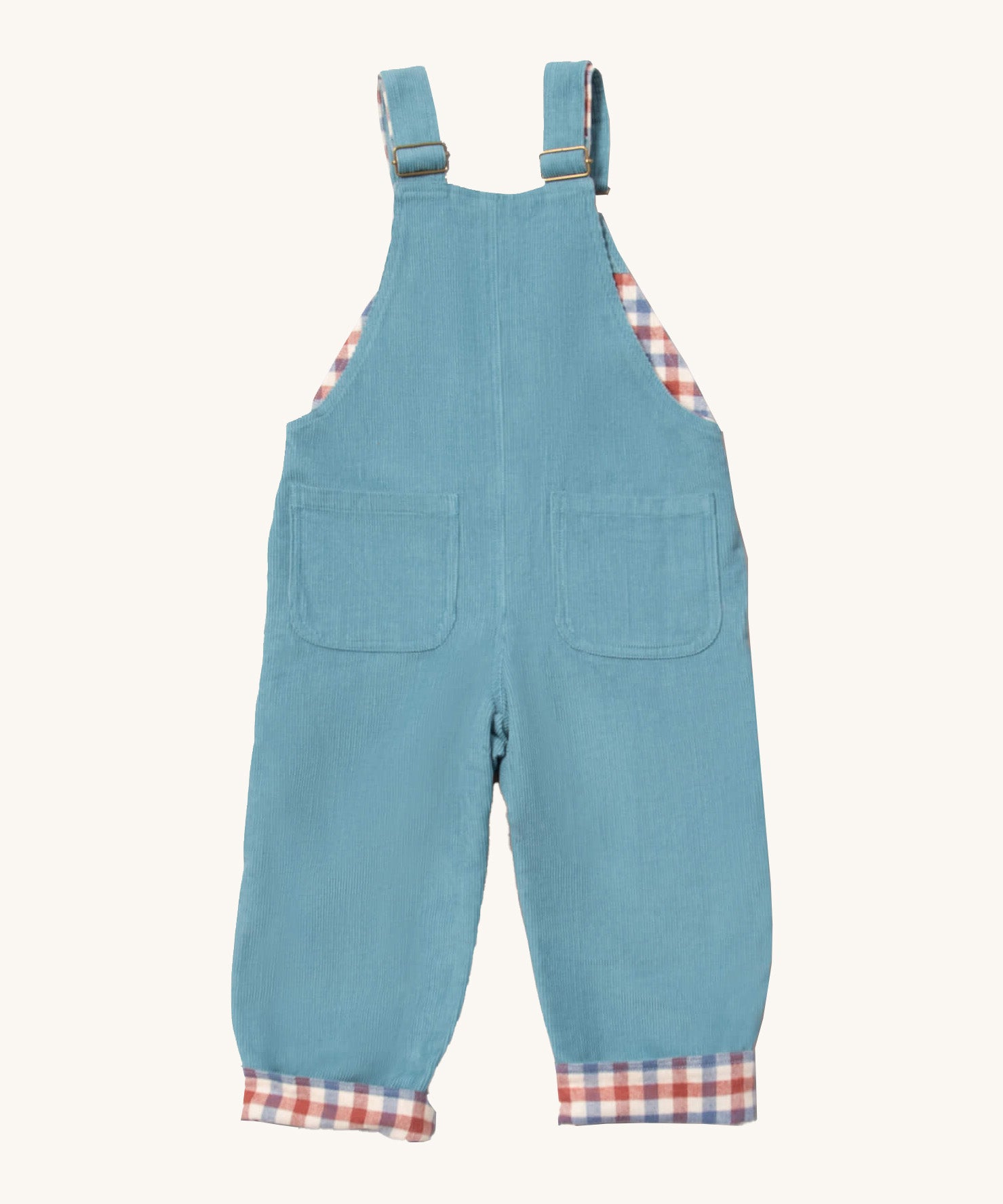 Little Green Radicals pale blue lined corduroy dungarees available at Babipur. A GOTS organic cotton dungaree in a corduroy style with a check inner. Features 2 back pockets and adjustable shoulder straps