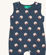 A close up of the Little Green Radicals everyday dungarees in sheep showing the button fastener detail on the shoulder straps and sheep print on navy organic cotton fabric.