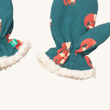 A close of the Little Green Radicals sherpa fleece mittens in foxes. Showing a close up of the fox print and soft elasticated cuff around the wrist for a secure fit  on turquoise organic cotton fabric.