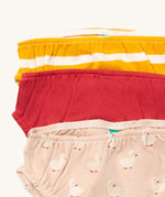 A close up of the Little Green Radicals puddle ducks underwear. Showing the trim detail and and a close up of each print and design on organic cotton fabric.