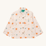 Little Green Radicals classic pyjama top from the moon and sun classic set. A GOTS organic cotton pyjama top in a classic shirt type style in light pink with prints of  a moon and sun with birds flying. Features button fasteners and a small chest pocket.