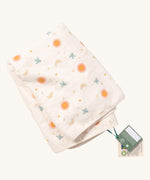 A folded Little Green Radicals sun and moon sherpa hooded blanket. A GOTS organic cotton white blanket with cute prints of birds flying around stars, the moon and the sun.