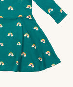A close up of the Little Green Radicals rainbow turquoise twirly dress showing the gentle gather detail on organic cotton fabric.