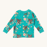 Little Green Radicals winter rabbit pyjama top. A GOTS organic cotton top in turquoise with a matching collar trim and prints of brown rabbits in pink flowers