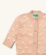 A close up of the Little Green Radicals knitted cardigan in puddle ducks showing the button detail and a close up of the white ducks on the soft pink GOTS organic cotton fabric and available at Babipur.