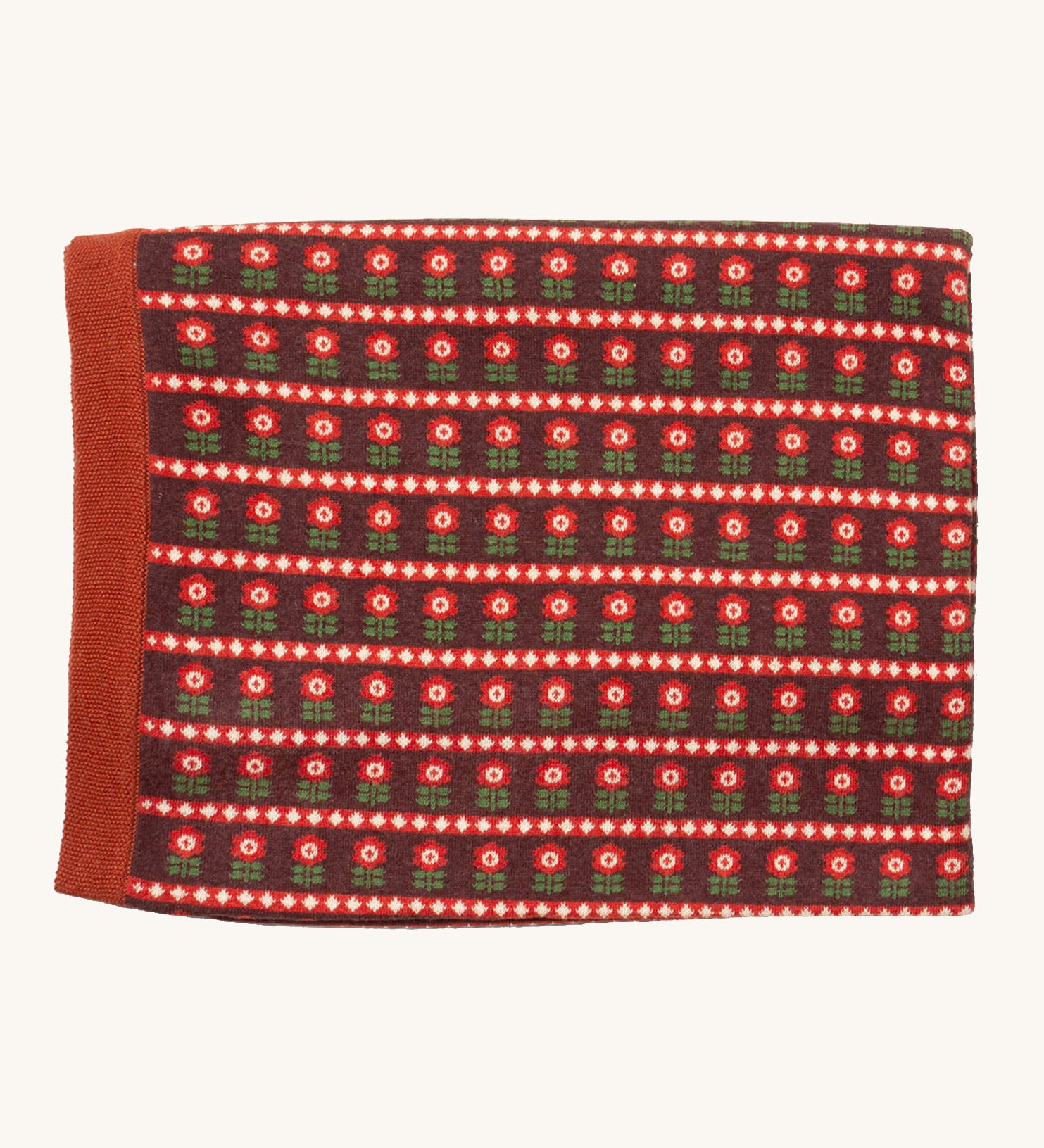 Little Green Radicals baby blanket in collecting flowers available at Babipur. A GOTS organic cotton blanket in brown with retro red flowers. Features a matching textured brown trim.