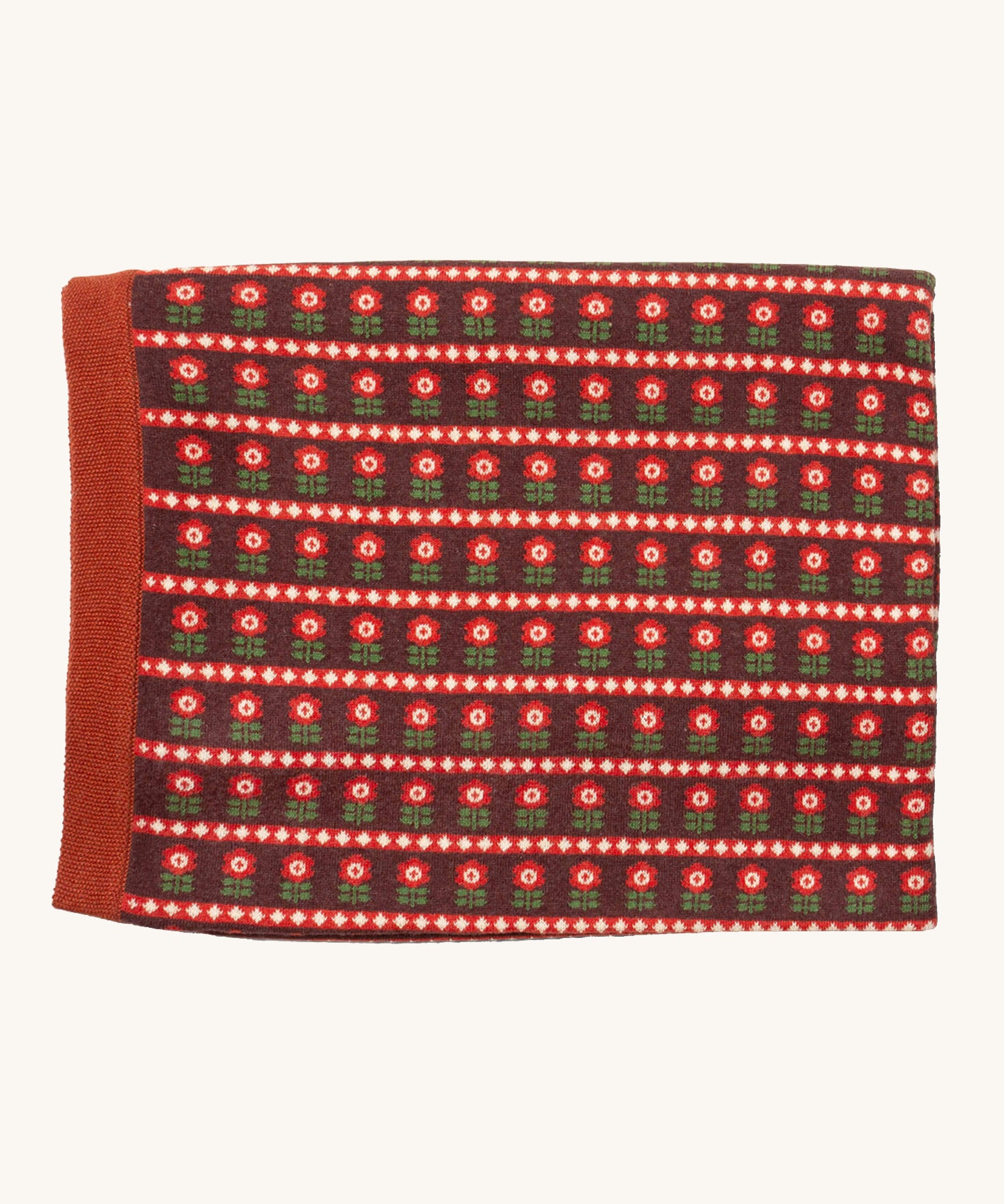 Little Green Radicals baby blanket in collecting flowers available at Babipur. A GOTS organic cotton blanket in brown with retro red flowers. Features a matching textured brown trim.