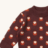 A close up of the  Little Green Radicals brown owl knitted jumper available at Babipur. Showing the owl detail and the thick collar on brown organic cotton fabric