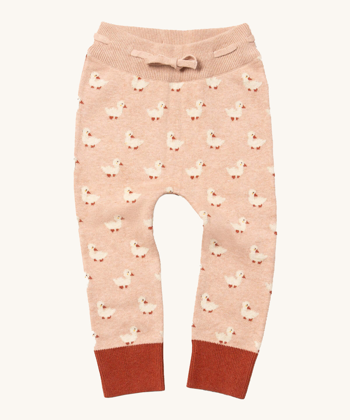 Little Green Radicals puddle ducks knitted leggings available at Babipur.. A soft GOTS knitted style leggings in light pink with red trim. Features an elasticated band with drawstring and cute duck knitted prints
