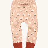 Little Green Radicals puddle ducks knitted leggings available at Babipur.. A soft GOTS knitted style leggings in light pink with red trim. Features an elasticated band with drawstring and cute duck knitted prints