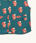 A close up of the Little Green Radicals reversible gilet in red foxes and sherpa lined. Showing the pouch pocket detail and a close up of the cute fox print on GOTS organic cotton fabric. 