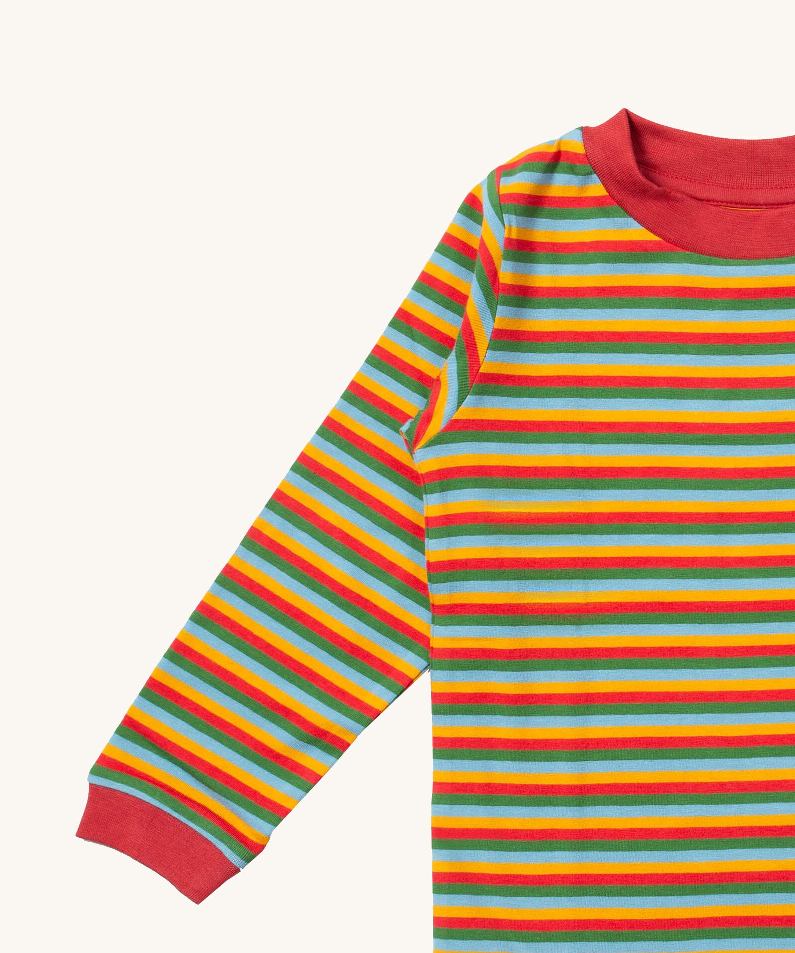 A close up of the Little Green Radicals autumn rainbow striped long sleeve top that's available at Babipur. Showing the autumn inspired coloured stripes detail on organic cotton fabric.