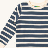 A close up of the Little Green Radicals midnight blue striped long sleeve top that's available at Babipur. Showing the navy and white stripe detail on organic cotton fabric.