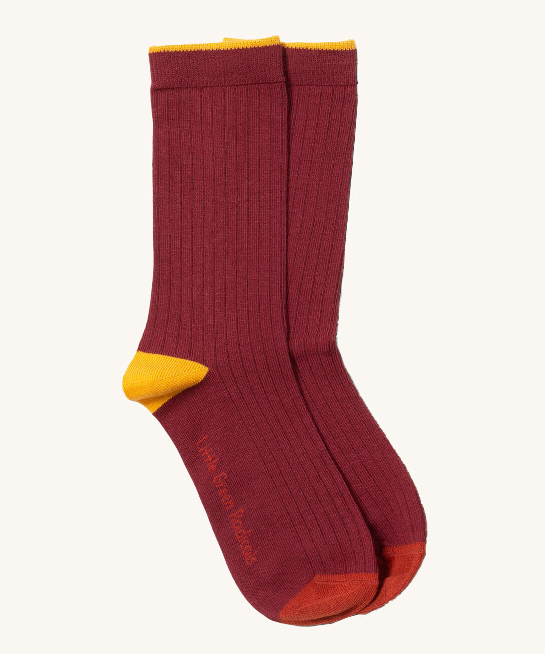Little Green Radicals dark maroon block ankle socks from the golden leaves set available at Babipur. A GOTS organic cotton sock with yellow and red trim with brand name on the sole.
