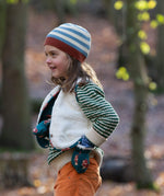 A child wearing the Little Green Radicals snuggly knitted jumper in olive stripe  with a reversible sherpa fleece fox gilet on top making a warm outfit available at Babipur.
