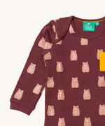 A close up of the Little Green Radicals teddy bear sleeve t-shirt. Showing the cute brown bear print and collar detail on dark maroon organic cotton fabric.