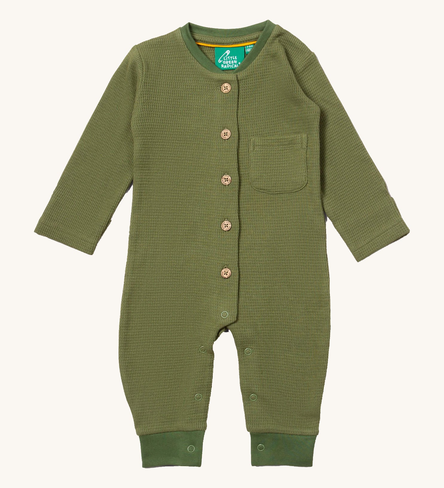 Little Green Radicals green chive waffle playsuit available at Babipur. A GOTS organic cotton all in one in a waffle knit style. Features button fasteners on the front and poppers around the crotch with a small pouch chest pocket