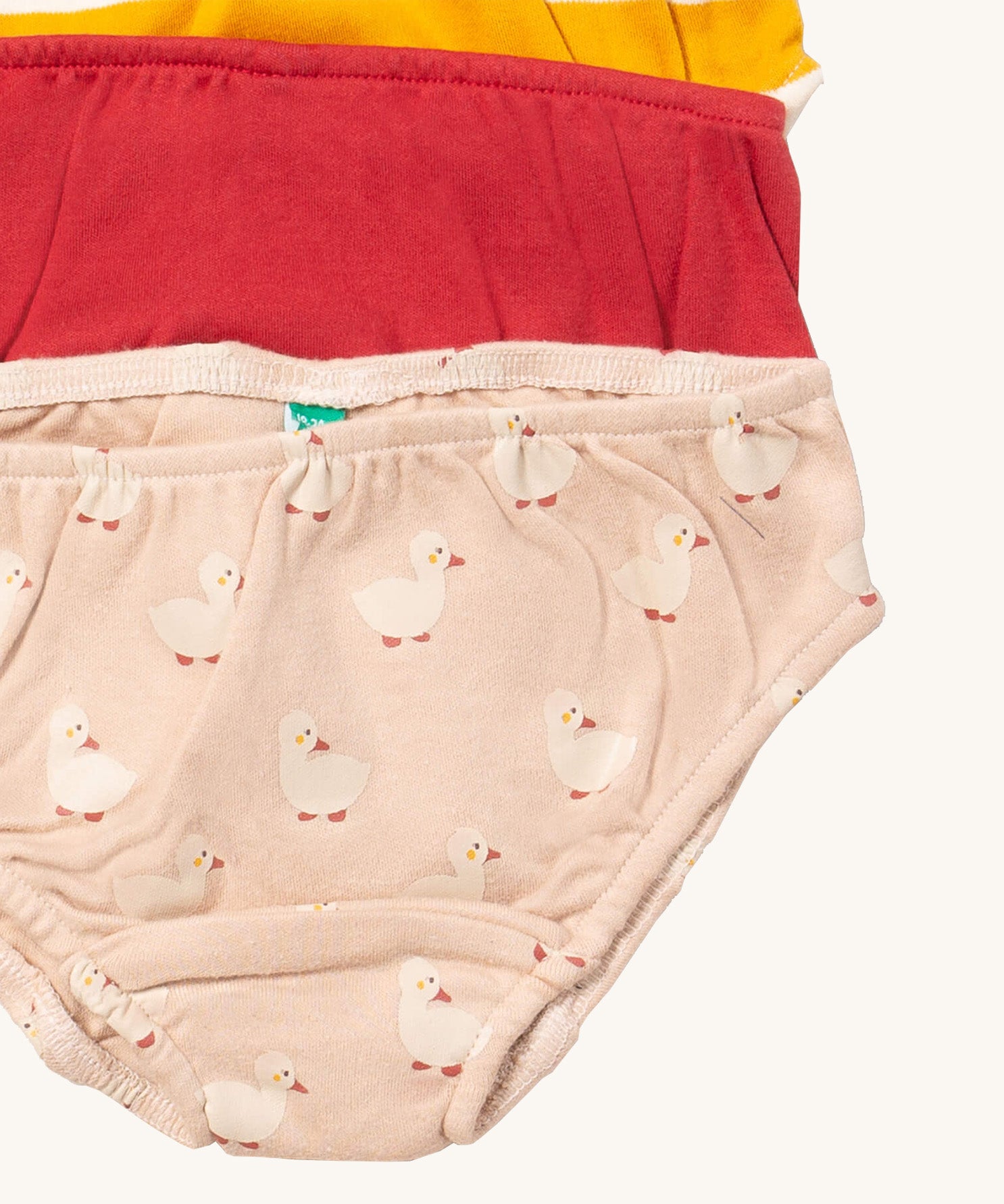 A close up of the Little Green Radicals puddle ducks underwear. Showing the trim detail and and a close up of the cute duck print on organic cotton fabric