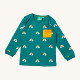 Little Green Radicals turquoise rainbow t-shirt. A GOTS organic cotton top with long sleeves in turquoise with prints of rainbows on clouds and a yellow chest pocket.