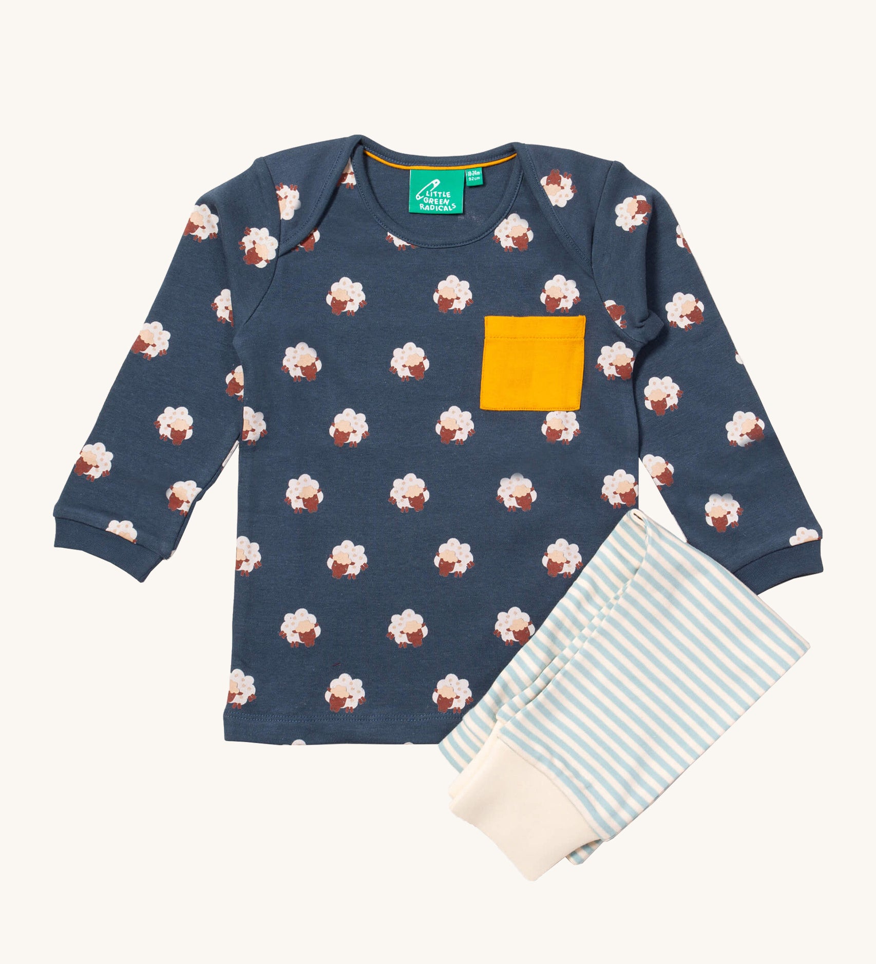 Little Green Radicals sleeping sheep playset available at Babipur. Features a GOTS organic cotton long sleeve t-shirt in navy with prints of cute sheep with a yellow chest pocket and a striped jogger in light blue and cream.