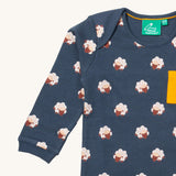 A close up of the Little Green Radicals sleeping sheep sleeve t-shirt. Showing the cute sheep print and collar detail on navy organic cotton fabric.
