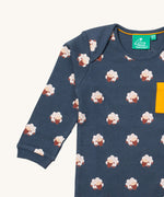 A close up of the Little Green Radicals sleeping sheep sleeve t-shirt. Showing the cute sheep print and collar detail on navy organic cotton fabric.
