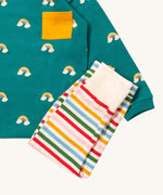 A close up of the Little Green Radicals rainbow inspired striped  jogger on top of the turquoise rainbow long sleeve t-shirt on organic cotton fabric