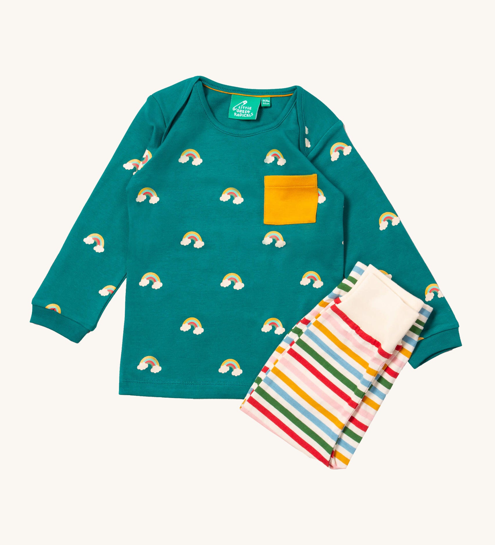Little Green Radicals turquoise rainbow playset available at Babipur. Features a GOTS organic cotton long sleeve t-shirt in turquoise with prints of little rainbows on clouds with a yellow chest pocket and a striped jogger in rainbow inspired colours.