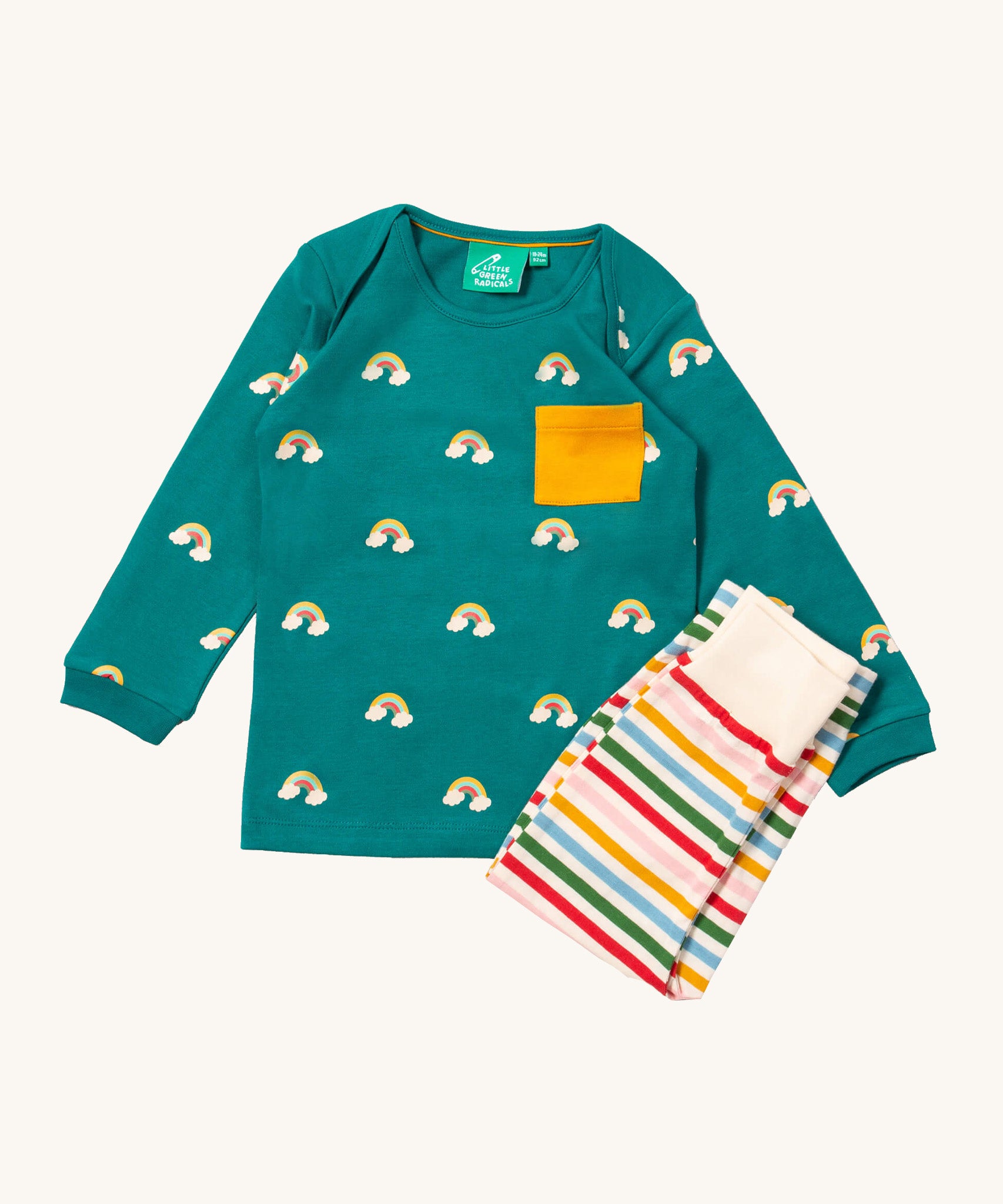 Little Green Radicals turquoise rainbow playset available at Babipur. Features a GOTS organic cotton long sleeve t-shirt in turquoise with prints of little rainbows on clouds with a yellow chest pocket and a striped jogger in rainbow inspired colours.