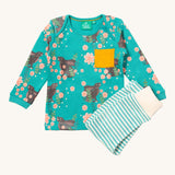 Little Green Radicals winter rabbits playset available at Babipur. Features a GOTS organic cotton long sleeve t-shirt in light turquoise with prints of rabbits in pink flowers with  a yellow chest pocket and a striped jogger in light turquoise and cream.