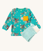 Little Green Radicals winter rabbits playset available at Babipur. Features a GOTS organic cotton long sleeve t-shirt in light turquoise with prints of rabbits in pink flowers with  a yellow chest pocket and a striped jogger in light turquoise and cream.