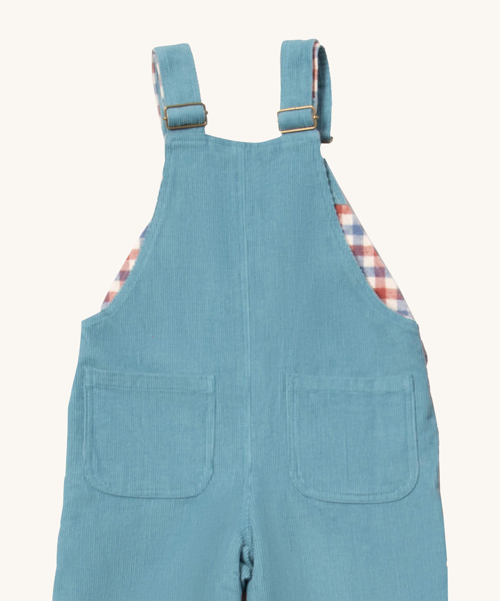 A close up of the Little Green Radicals pale blue lined corduroy dungarees. Showing the back pocket detail on blue corduroy organic cotton fabric