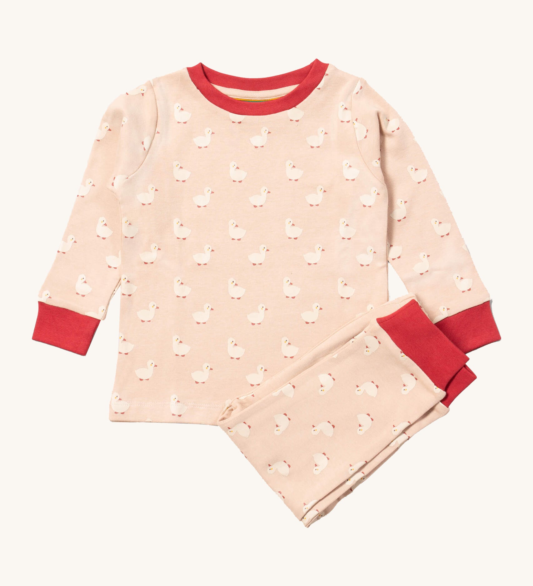 Little Green Radicals puddle ducks pyjama set available at Babipur.. A GOTS organic cotton pyjama top and bottom set in light pink with red trim and cute duck prints.