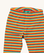 A close up of the Little Green Radicals rainbow striped organic leggings. Showing the elasticated detail and rainbow striped design on organic cotton fabric