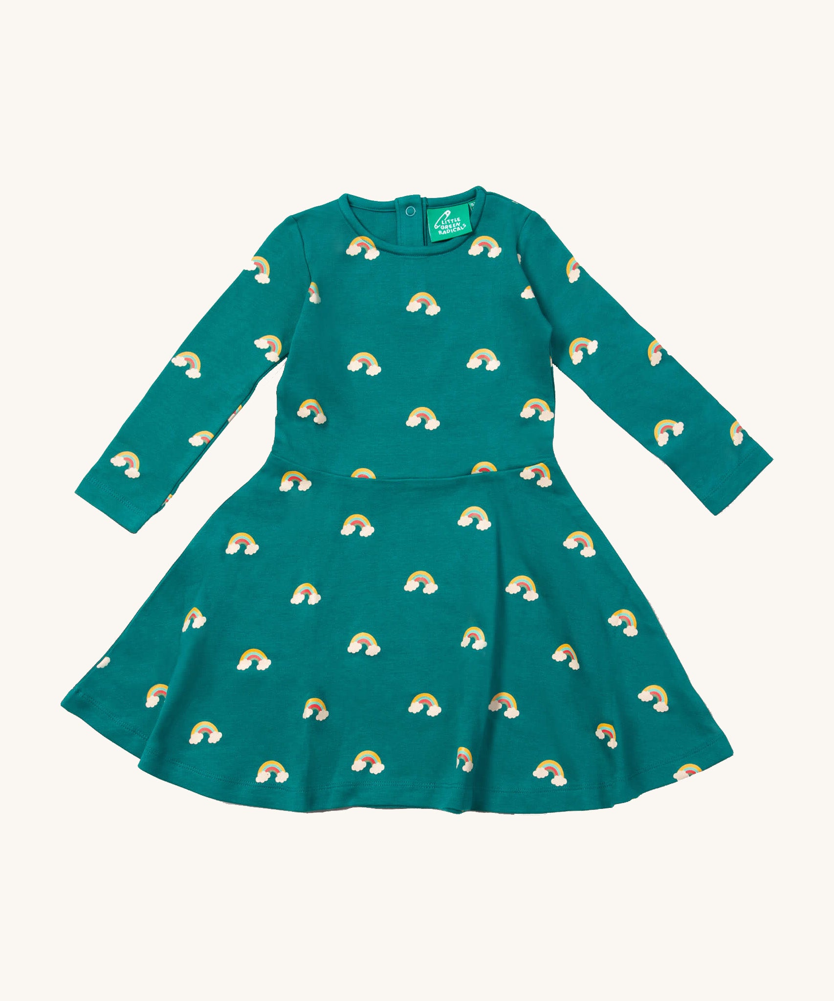Little Green Radicals rainbow turquoise twirly dress available at Babipur. A GOTS organic cotton dress with long sleeves a popper fastener on the back. Features cute prints of rainbows on clouds.