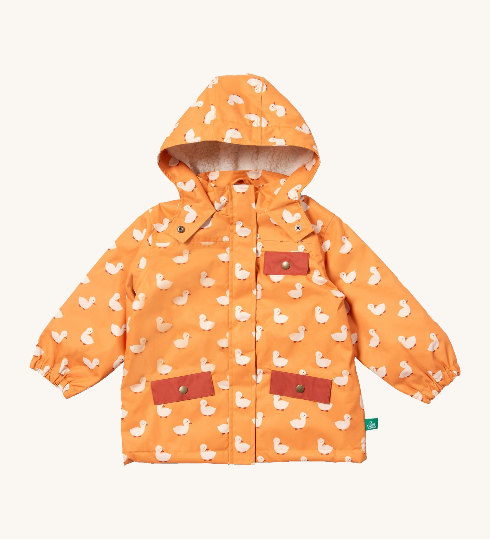 Little Green Radicals waterproof adventure coat in gold ducks available at Babipur. A yellow waterproof coat with cute white duck prints and red trim. Features a hood with a white sherpa fleece liner, a full length zip, a chest pocket and 2 side pockets. 