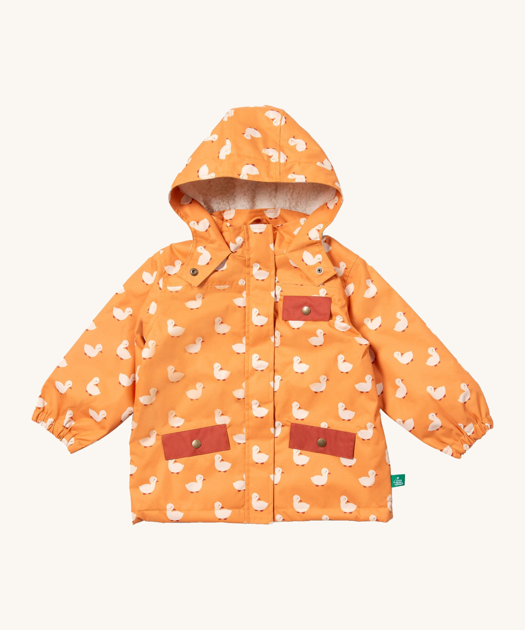 Little Green Radicals waterproof adventure coat in gold ducks available at Babipur. A yellow waterproof coat with cute white duck prints and red trim. Features a hood with a white sherpa fleece liner, a full length zip, a chest pocket and 2 side pockets. 