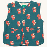 Little Green Radicals reversible gilet in red foxes and sherpa lined. A GOTS organic cotton gilet in teal with cute prints of foxes , 2 pouch pockets on the side and button fasteners. 