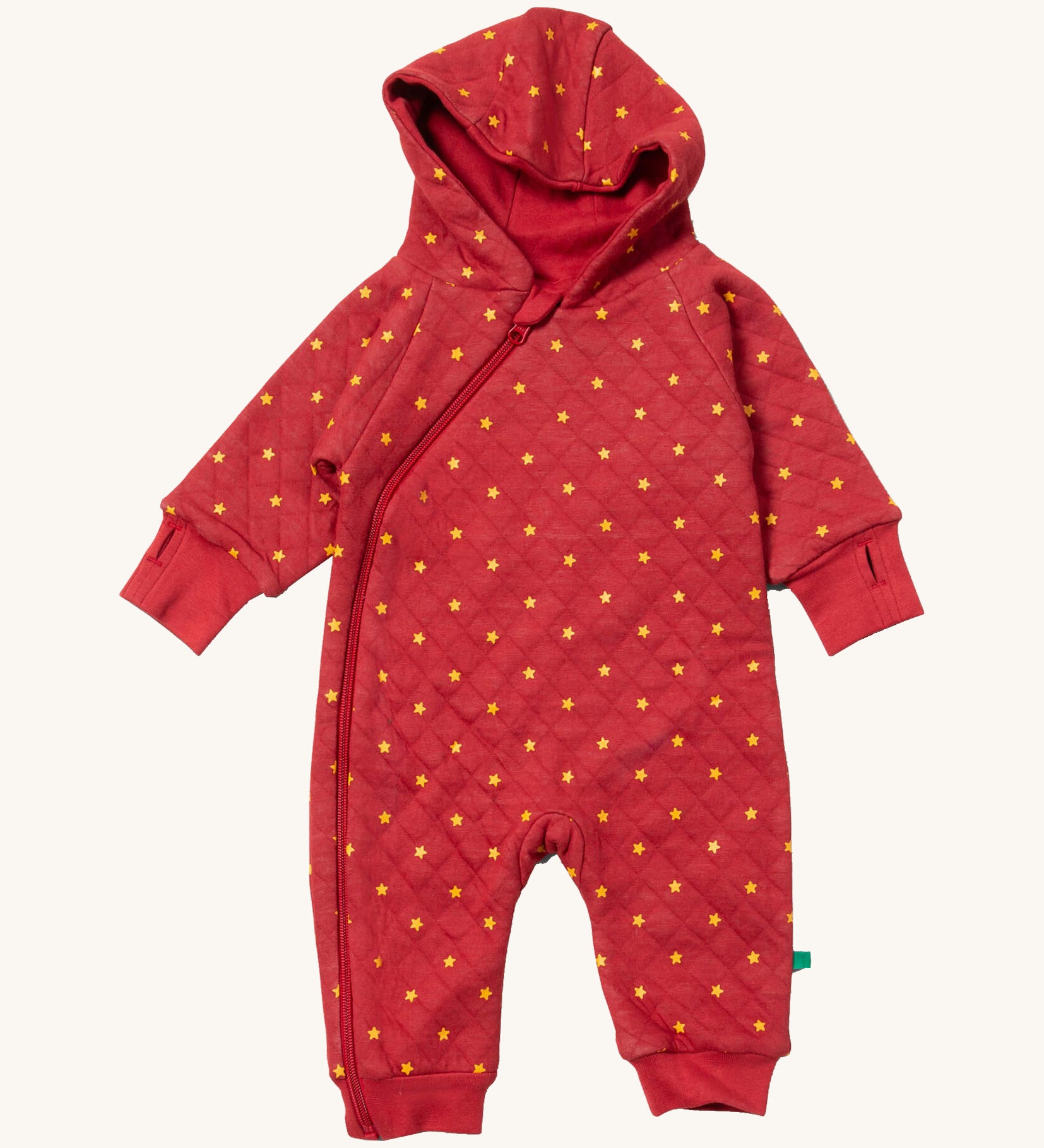 Little Green Radicals hooded snug suit in red stars. A GOTS organic cotton all in one suit in red. Features a full length zip thumb holes and yellow stars scattered all over