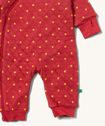 A close up of the Little Green Radicals hooded snug suit in flying birds showing the arm and leg cuff detail 