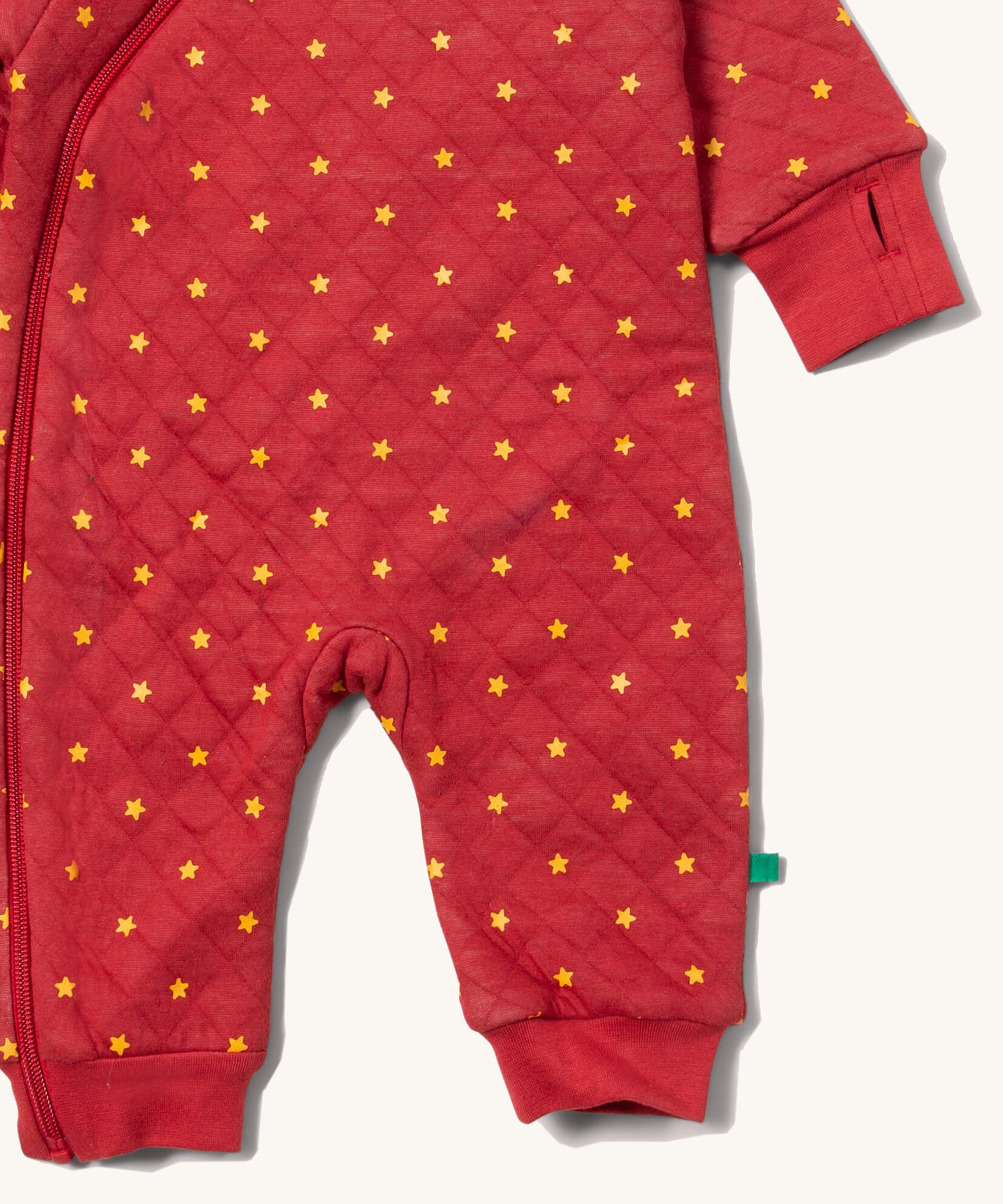 A close up of the Little Green Radicals hooded snug suit in flying birds showing the arm and leg cuff detail 