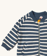 A close up of the Little Green Radicals reversible easy rider jacket in sleeping sheep. Showing the collar detail and zip detail which features a yellow toggle for easy opening and closing 