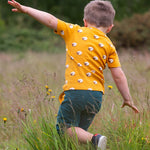 this t-shirt has a fun sheep print on orange fabric