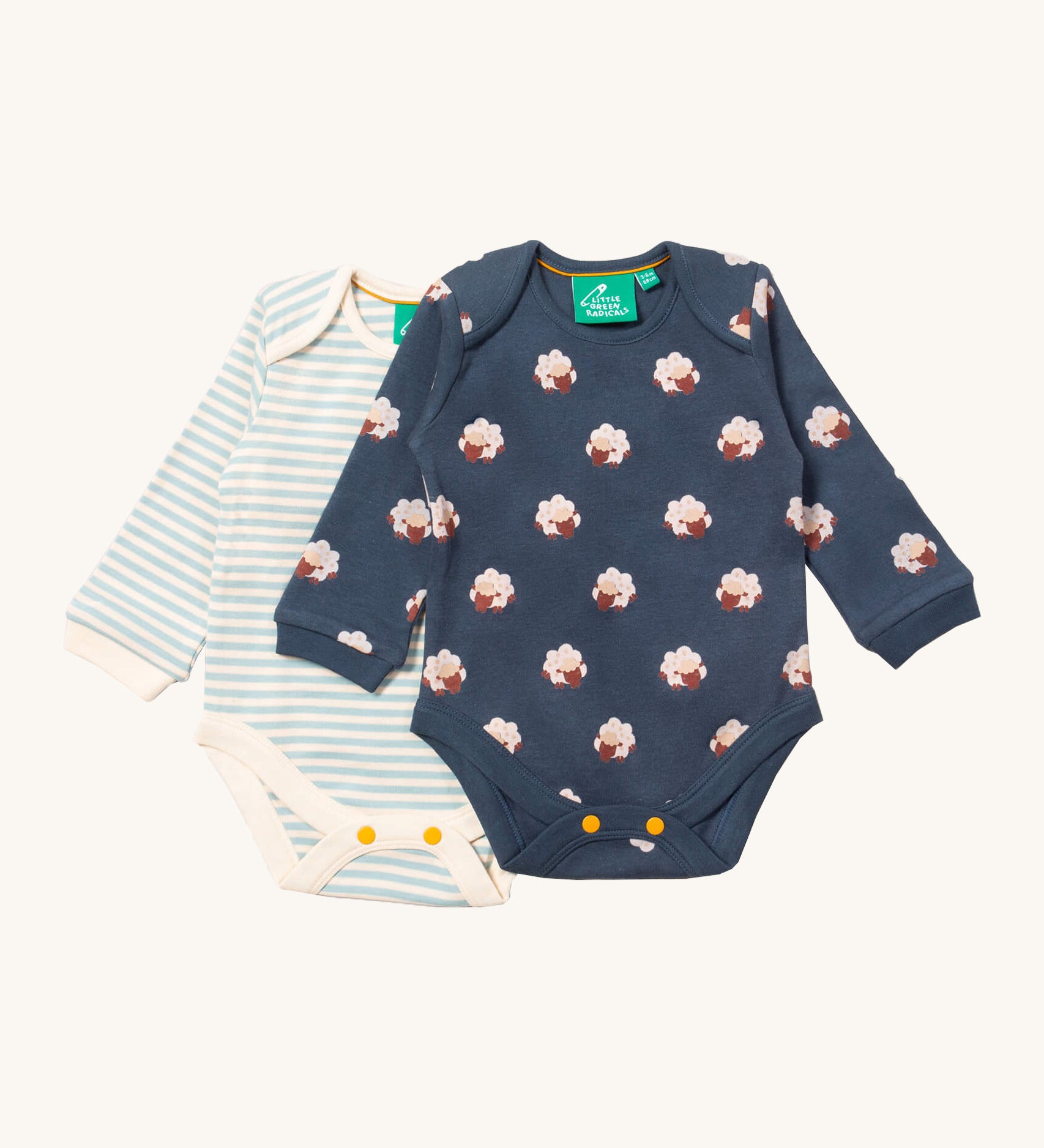 Little Green Radicals sheep baby body suit 2 pack available at Babipur. A soft GOTS organic cotton bodysuit 2 pack in navy with a cute sheep print and a light blue and cream striped bodysuit. Features yellow popper fastener around the crotch