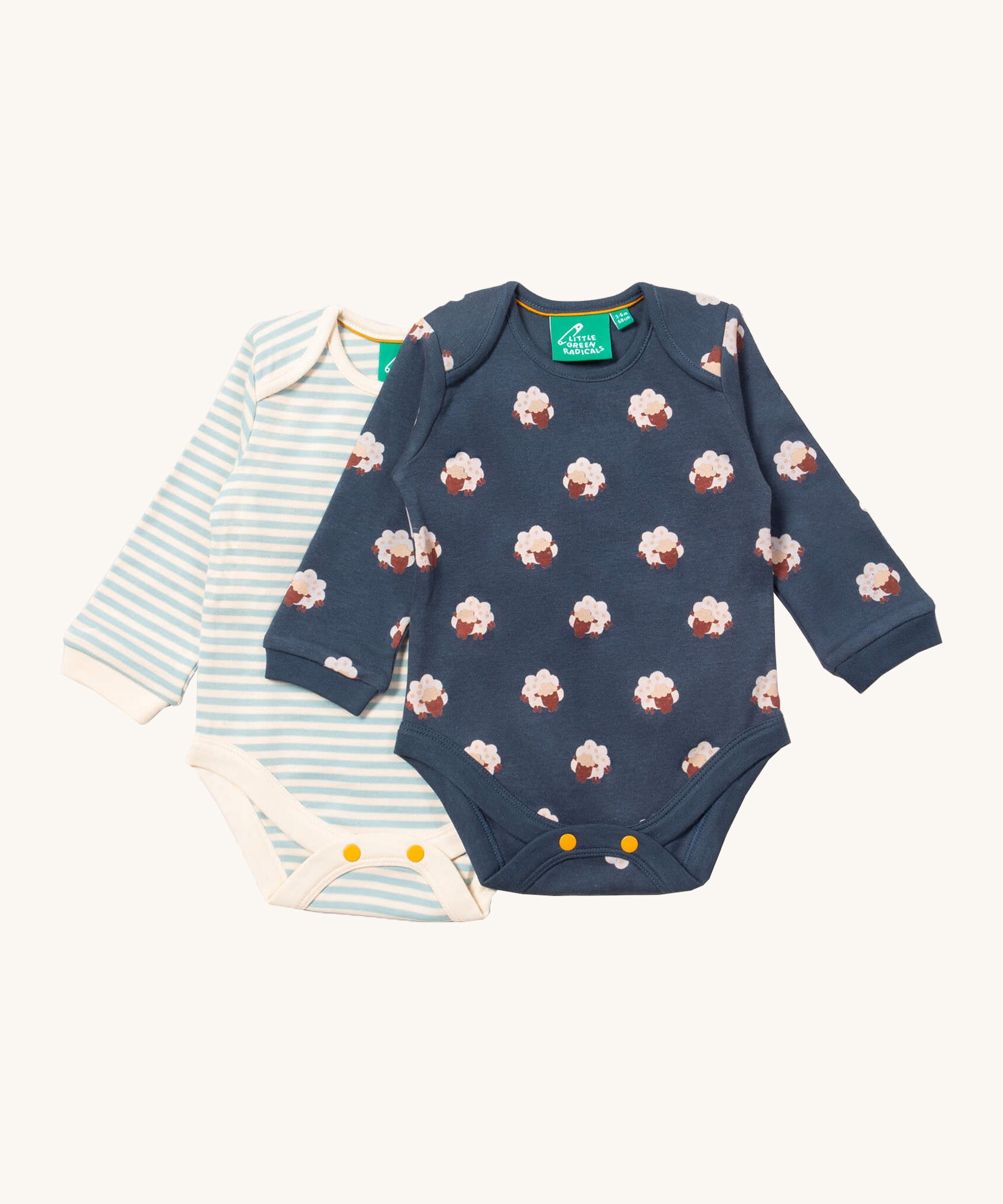 Little Green Radicals sheep baby body suit 2 pack available at Babipur. A soft GOTS organic cotton bodysuit 2 pack in navy with a cute sheep print and a light blue and cream striped bodysuit. Features yellow popper fastener around the crotch