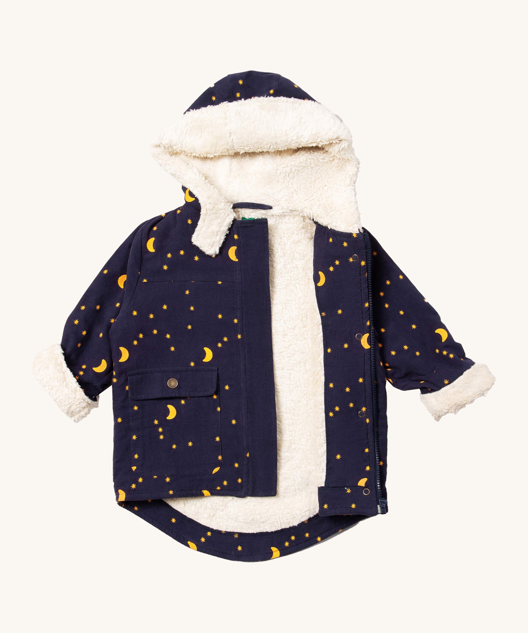 Little Green Radicals dark night sherpa toasty coat available at  Babipur. A GOTS organic cotton winter corduroy style jacket  in navy with a white fleece inner for warmth. Features a full length zip and popper fasteners for a secure fit.