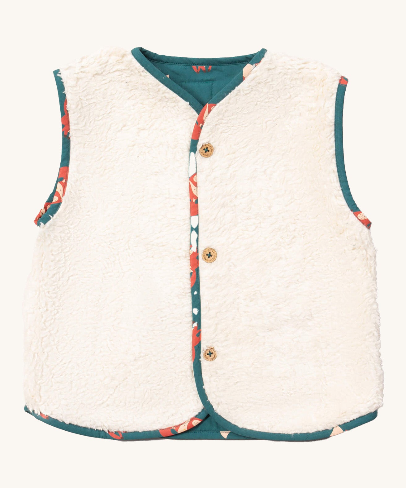 Little Green Radicals reversible gilet in red foxes and sherpa lined. A GOTS organic cotton gilet with a sherpa fleece style on the reversed side with the teal and fox prints trim. Features button fasteners for opening and closing. 